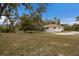 Ranch-style home with a large yard and mature trees at 6424 18Th E Ave, Bradenton, FL 34208