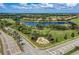 Aerial view of River Strand community, showcasing homes, golf course, and lake at 6579 Willowshire Way, Bradenton, FL 34212