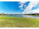 Stunning lakefront property with lush green landscaping at 6579 Willowshire Way, Bradenton, FL 34212