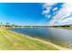 Scenic view of a tranquil lake and community homes at 6579 Willowshire Way, Bradenton, FL 34212