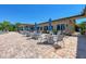 Poolside seating area with tables and umbrellas at 6579 Willowshire Way, Bradenton, FL 34212