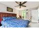 Primary bedroom with ceiling fan and ensuite bathroom at 7117 27Th Ave Dr W # 7117, Bradenton, FL 34209