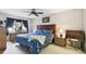 Primary bedroom with ceiling fan and wooden furniture at 7117 27Th Ave Dr W # 7117, Bradenton, FL 34209