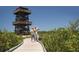 Couple strolls along a boardwalk near a wooden observation tower at 7117 27Th Ave Dr W # 7117, Bradenton, FL 34209