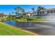 Country Village entrance with pond and landscaping at 7117 27Th Ave Dr W # 7117, Bradenton, FL 34209