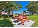 Red picnic tables and grills are available for resident use in this shady spot at 7117 27Th Ave Dr W # 7117, Bradenton, FL 34209