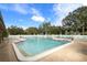 Community swimming pool with lounge chairs at 7117 27Th Ave Dr W # 7117, Bradenton, FL 34209