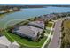 Aerial view of house and community by the lake at 712 Sigsbee Loop, Sarasota, FL 34240