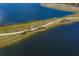 Aerial view showing a scenic lakeside walking path at 712 Sigsbee Loop, Sarasota, FL 34240