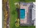 Aerial view of house with pool and screened enclosure at 712 Sigsbee Loop, Sarasota, FL 34240