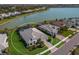 Aerial view showcasing a house in a waterfront community at 712 Sigsbee Loop, Sarasota, FL 34240