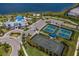 Aerial view of community amenities including tennis courts at 712 Sigsbee Loop, Sarasota, FL 34240