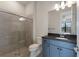 Clean bathroom with shower, toilet and dark vanity at 712 Sigsbee Loop, Sarasota, FL 34240