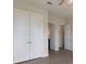 Bright bedroom with double doors to closets and bath at 712 Sigsbee Loop, Sarasota, FL 34240