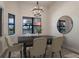 Bright dining room featuring a large table and water views at 712 Sigsbee Loop, Sarasota, FL 34240