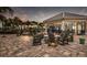 Community fire pit with seating and views of the clubhouse at 712 Sigsbee Loop, Sarasota, FL 34240