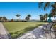 Relaxing grassy lawn area with seating near water at 712 Sigsbee Loop, Sarasota, FL 34240