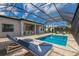 Relaxing pool and patio area with lounge chairs at 712 Sigsbee Loop, Sarasota, FL 34240