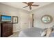 Cozy bedroom with a queen-size bed and direct access to a bathroom at 7312 Riviera Cv, Lakewood Ranch, FL 34202