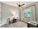 Charming bedroom with two metal chairs and a stylish area rug at 7312 Riviera Cv, Lakewood Ranch, FL 34202