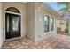 Elegant entryway with arched doorway and decorative glass at 7312 Riviera Cv, Lakewood Ranch, FL 34202