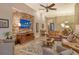 Living room showcasing a stone fireplace, hardwood floors, and comfortable seating at 7312 Riviera Cv, Lakewood Ranch, FL 34202