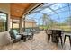 Screened patio with seating area and fire pit, overlooks pool at 7312 Riviera Cv, Lakewood Ranch, FL 34202