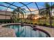 Enjoy beautiful sunset views from this screened-in pool area at 7312 Riviera Cv, Lakewood Ranch, FL 34202