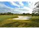 Golf course sand trap with surrounding green grass at 7312 Riviera Cv, Lakewood Ranch, FL 34202