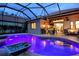 Relaxing swimming pool with water features and lighting at 7312 Riviera Cv, Lakewood Ranch, FL 34202