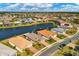 Aerial view of home community with lake and houses at 7432 Summerland Cv, Lakewood Ranch, FL 34202