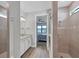 Modern bathroom with double sinks and a view to bedroom at 7432 Summerland Cv, Lakewood Ranch, FL 34202