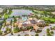 Aerial view of community clubhouse with pool and tennis courts at 7432 Summerland Cv, Lakewood Ranch, FL 34202