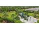 Fenced dog park with shaded seating and separate areas for dogs at 7432 Summerland Cv, Lakewood Ranch, FL 34202