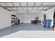 Spacious garage with epoxy flooring and overhead storage at 7432 Summerland Cv, Lakewood Ranch, FL 34202