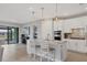 Modern white kitchen with stainless steel appliances at 7432 Summerland Cv, Lakewood Ranch, FL 34202