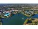 Community overview featuring lake, tennis courts, and clubhouse at 7575 Quinto Dr, Sarasota, FL 34238