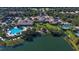 Aerial view of community with pool, clubhouse, and lake at 7575 Quinto Dr, Sarasota, FL 34238