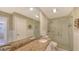 Bathroom with granite countertop, double vanity, and shower at 7575 Quinto Dr, Sarasota, FL 34238