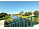 Peaceful waterfront view with lush green landscaping at 7575 Quinto Dr, Sarasota, FL 34238