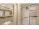 Bright closet with hanging rods and shelves at 7575 Quinto Dr, Sarasota, FL 34238