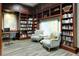 Quiet community library features bookshelves and comfy armchairs at 7575 Quinto Dr, Sarasota, FL 34238