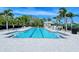 Resort-style lap pool with spacious deck and lounge chairs at 7575 Quinto Dr, Sarasota, FL 34238