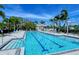 Community lap pool with ample seating and shade at 7575 Quinto Dr, Sarasota, FL 34238