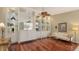 Built-in shelving and hardwood floors in living room at 7575 Quinto Dr, Sarasota, FL 34238