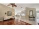 Open living area with hardwood floors, a comfortable sofa, and a view of the kitchen at 7575 Quinto Dr, Sarasota, FL 34238