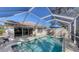 Enjoy this screened-in pool and patio with ample seating at 7575 Quinto Dr, Sarasota, FL 34238