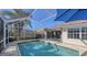 Spacious screened-in pool and patio area, with plenty of seating at 7575 Quinto Dr, Sarasota, FL 34238