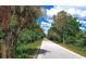 Paved path through lush Florida landscape at 7575 Quinto Dr, Sarasota, FL 34238