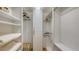 Bright walk-in closet with custom shelving and hanging rods at 7575 Quinto Dr, Sarasota, FL 34238